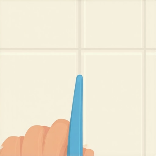 Person scrubbing grout lines with a toothbrush and cleaning paste to remove stains